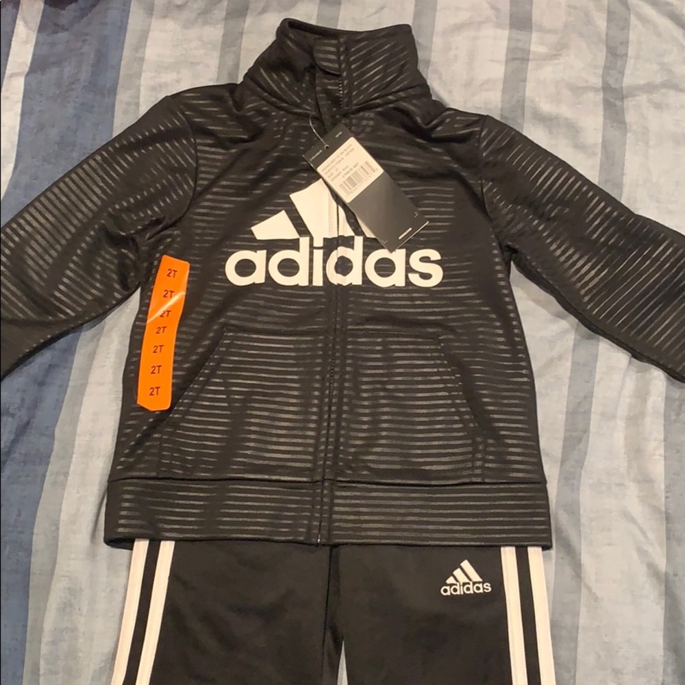 A two piece Adidas track suit
